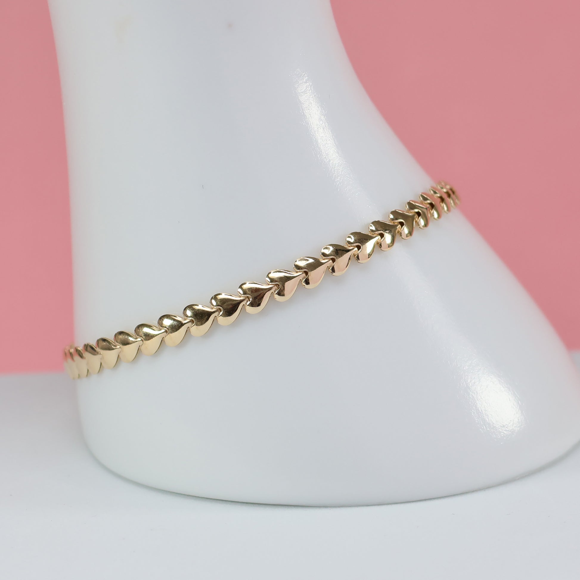 Gold heart link bracelet for her with elegant design and shiny finish