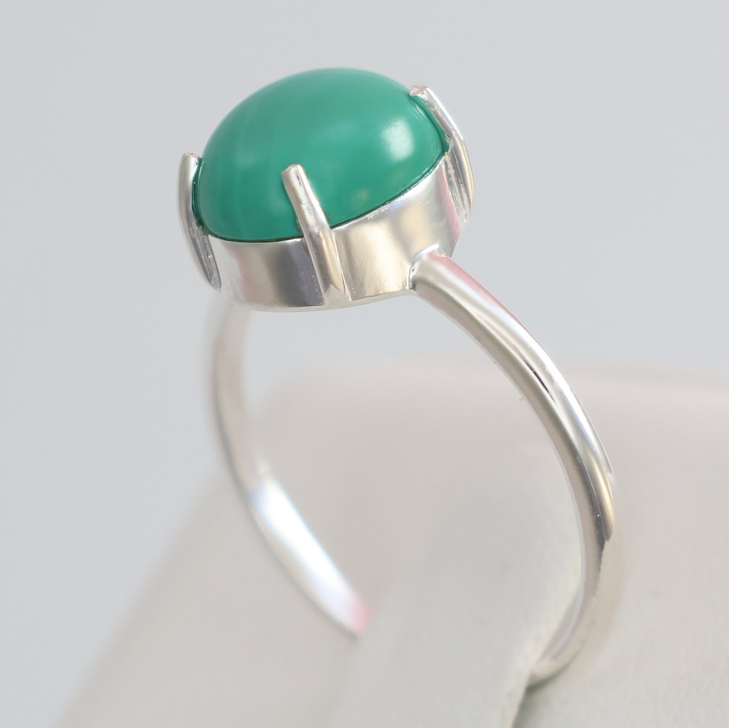 Large malachite stone ring in silver setting, showcasing a polished dome design for elegant style