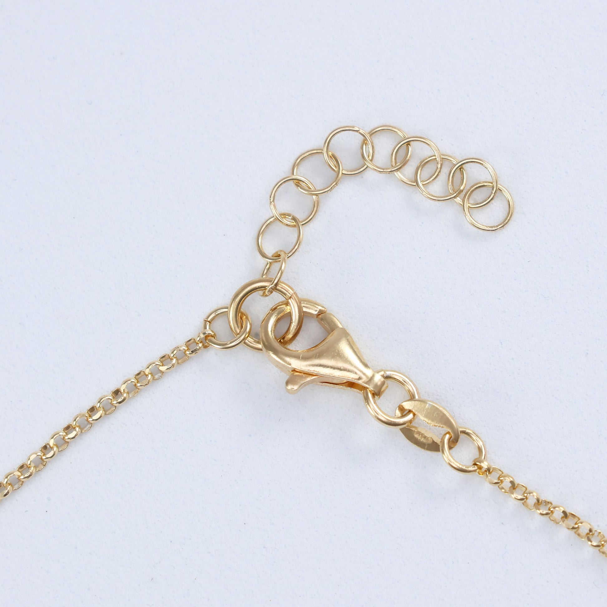 Gold clasp detail of a chain for the large ring hoop halo pendant from thejewelleryshop.co.uk
