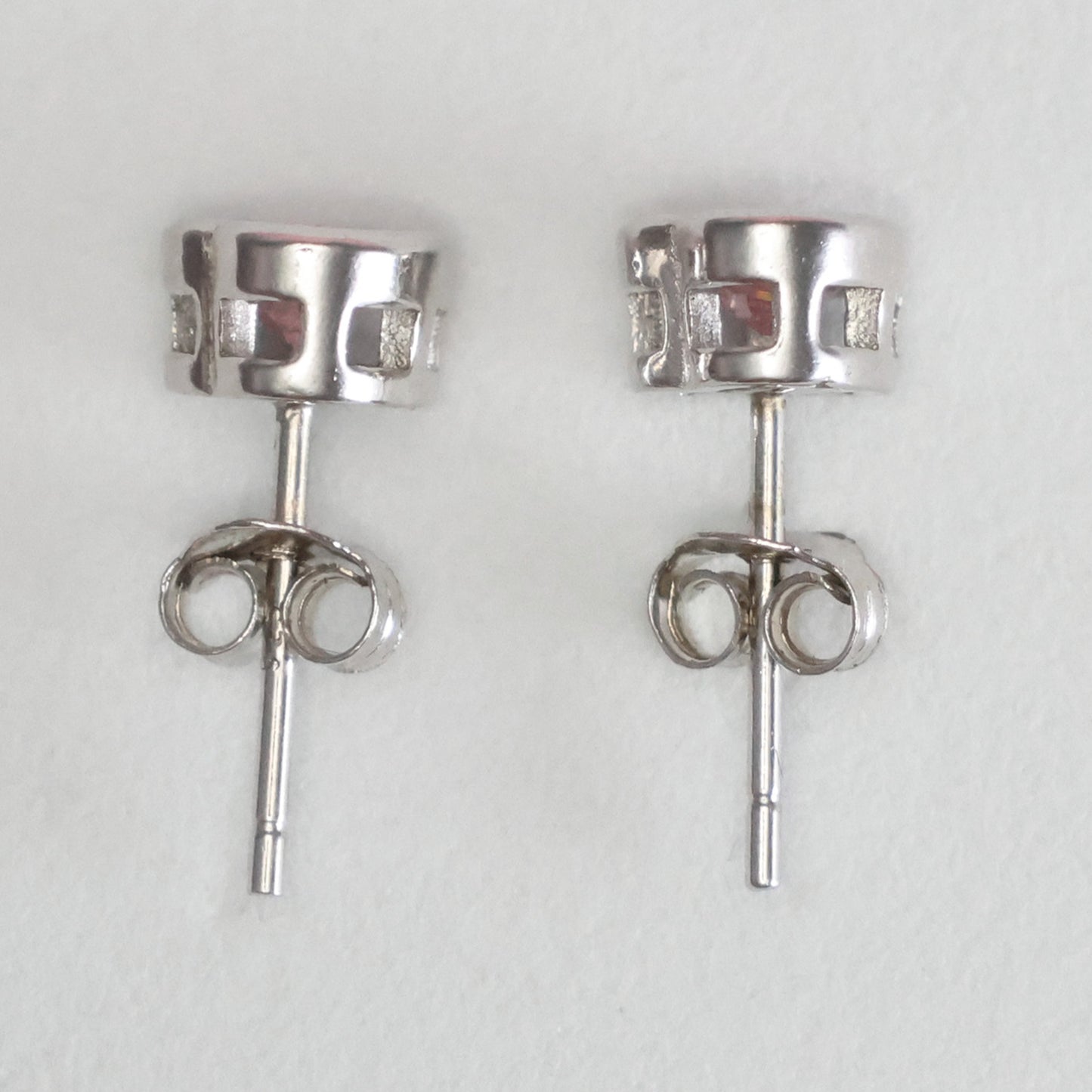 Elegant pink gemstone stud earrings in a silver setting for a classy look