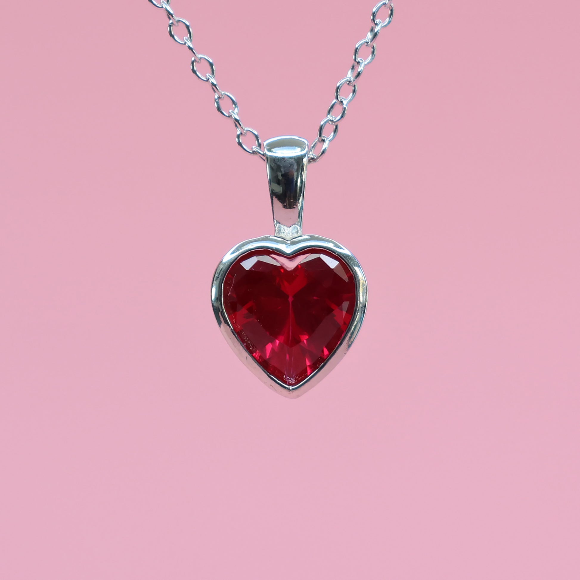 Red heart cubic zirconia pendant on a silver chain with a sparkling finish