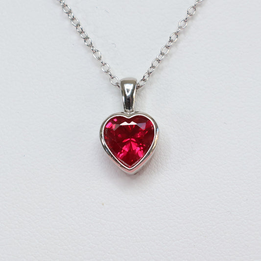 Red heart cubic zirconia pendant with a silver chain, perfect for adding elegance to any outfit