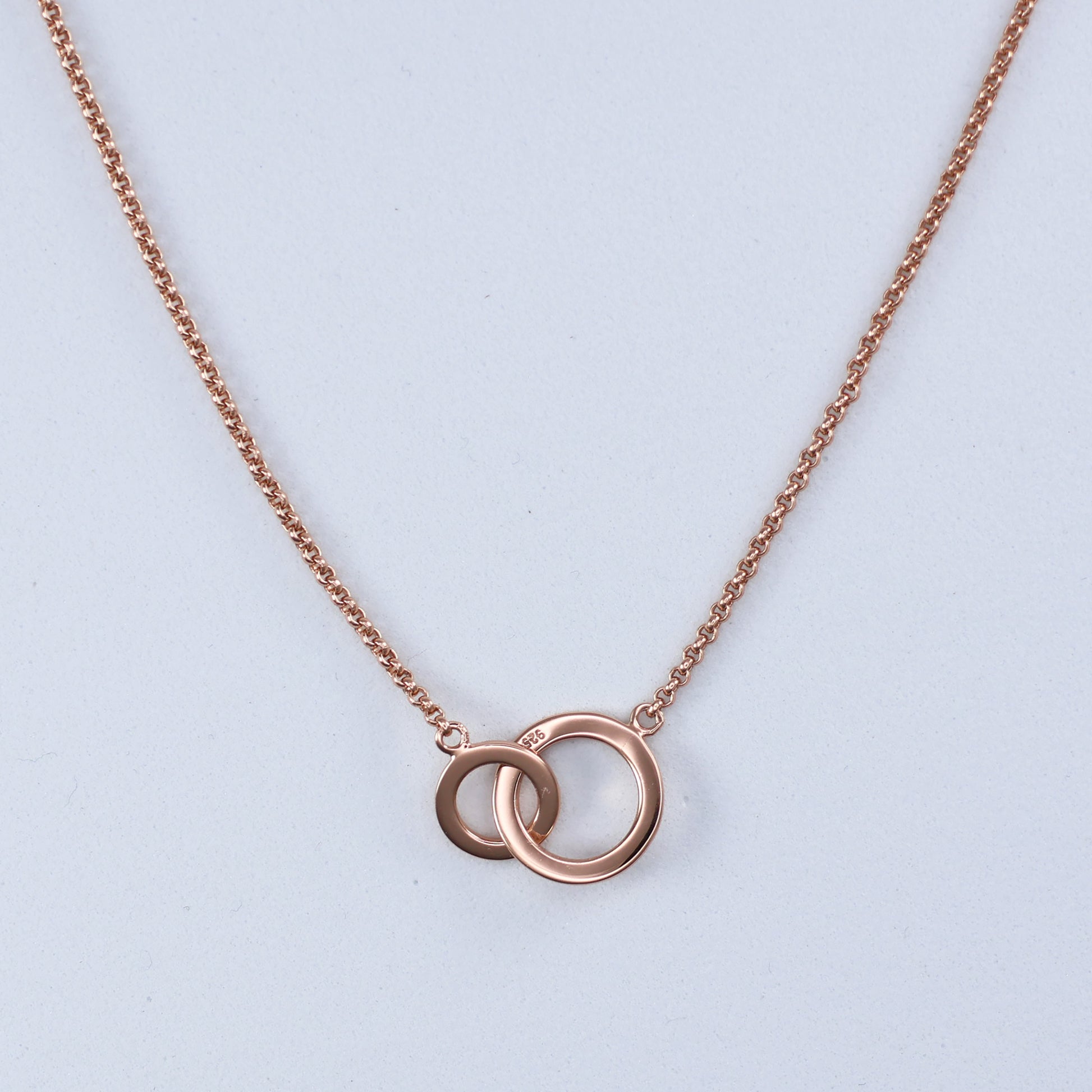 Elegant rose gold double hoop pendant on a fine chain for a stylish accessory