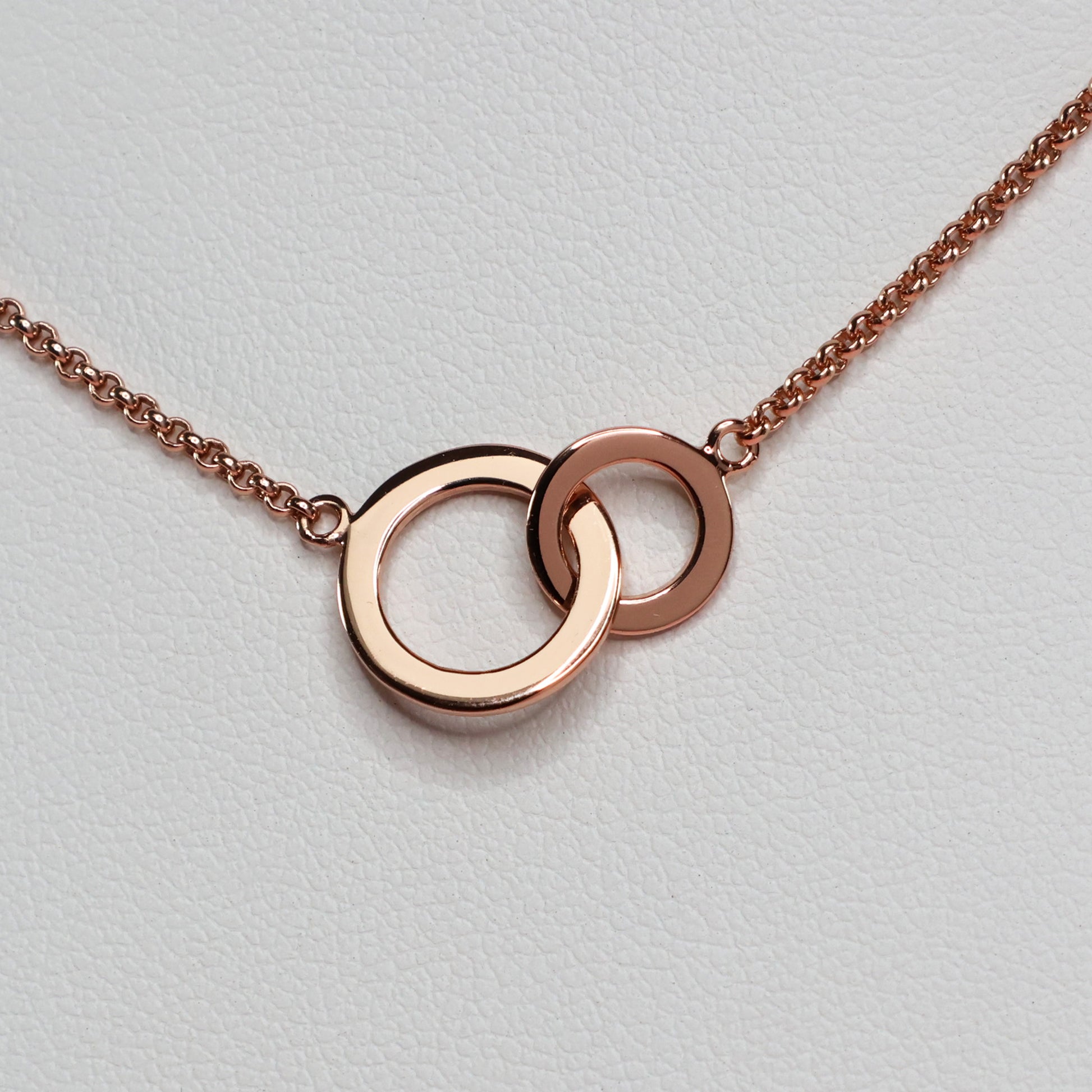 Rose gold double hoop pendant on a delicate chain, perfect for everyday elegance