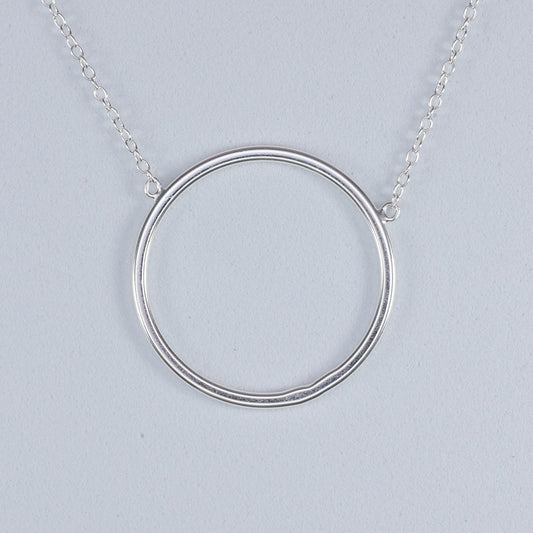 Elegant silver circle pendant necklace with a simple and modern design from thejewelleryshop.co.uk