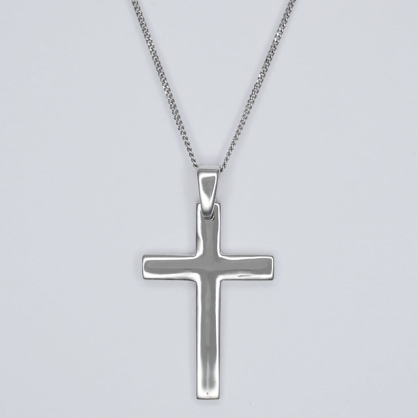 Polished silver cross pendant necklace with a sleek design for everyday wear