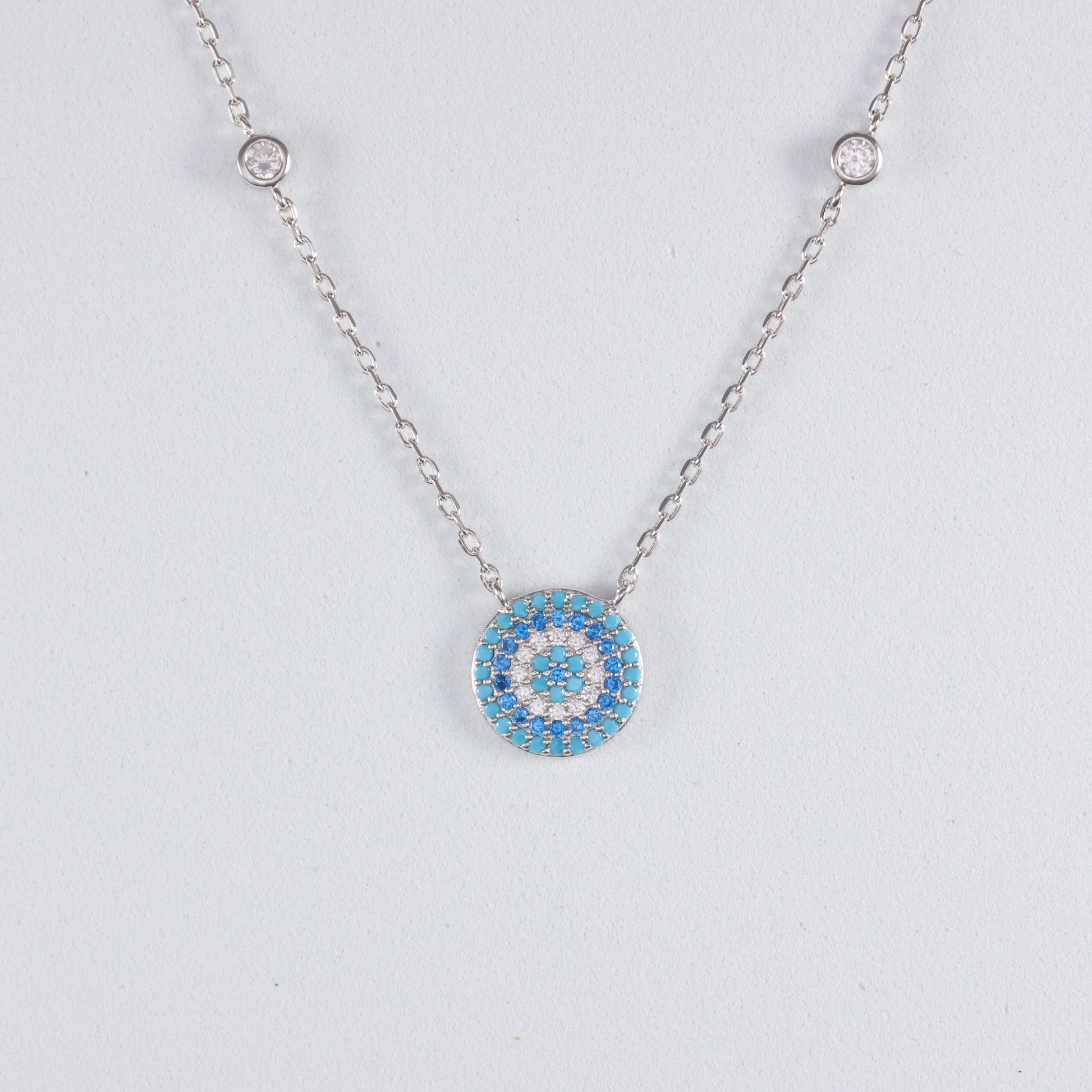 Silver Evil Eye Pendant with Turquoise and Clear Crystal Details on a Delicate Chain