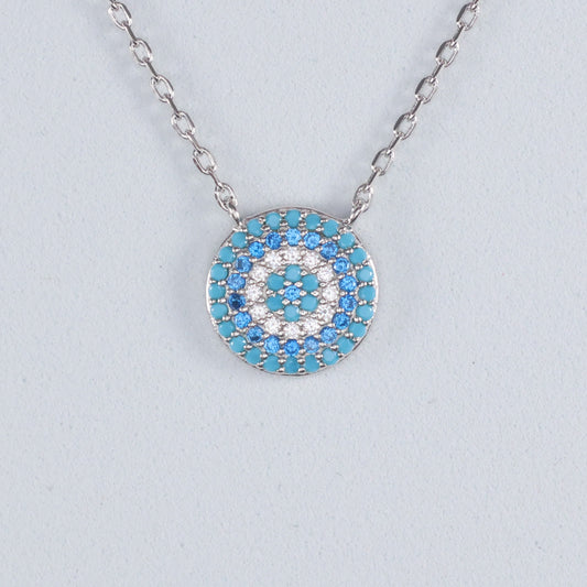 Silver Evil Eye Pendant with turquoise and white gemstones on a delicate chain