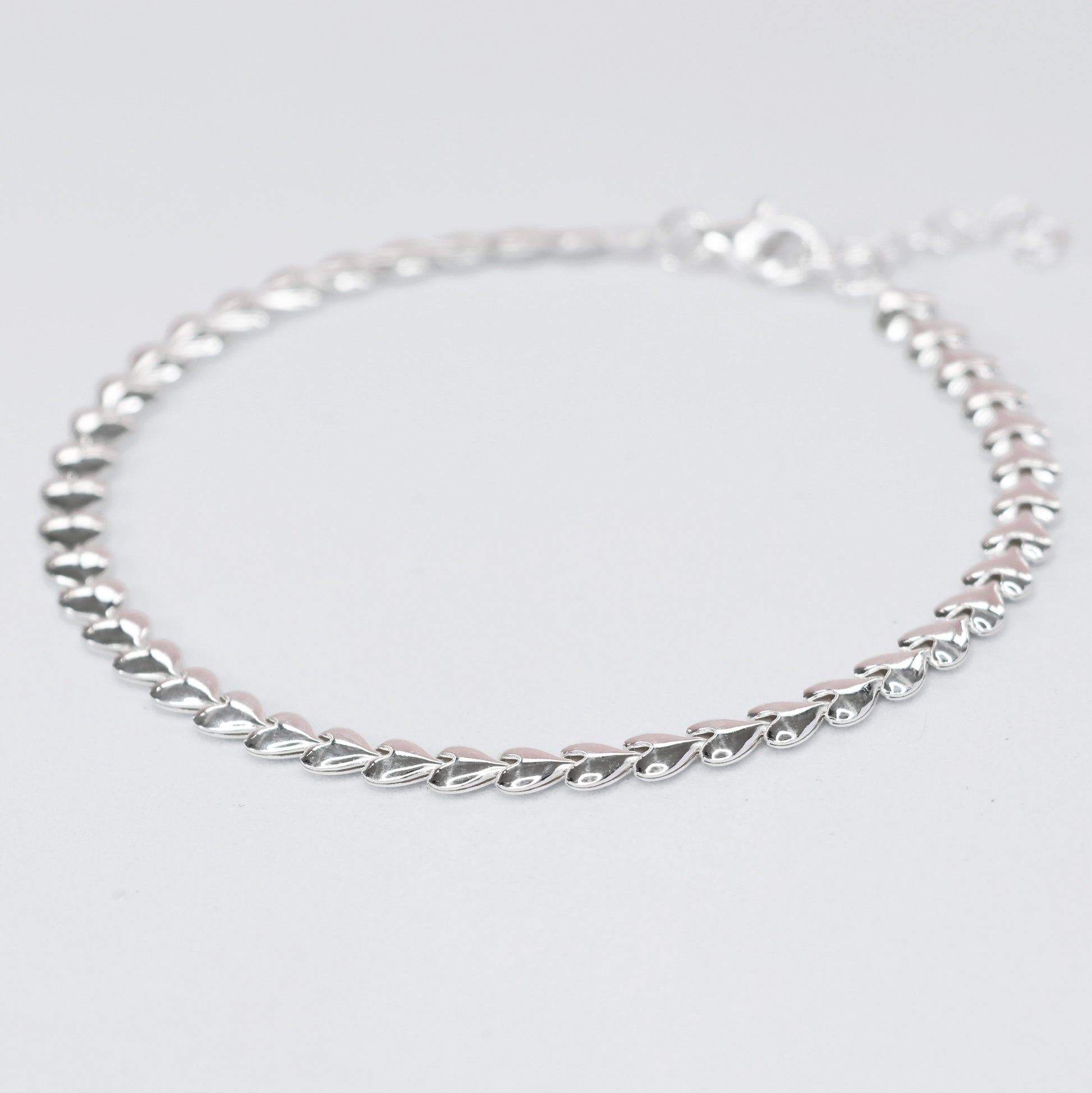 Elegant silver heart link bracelet with a sleek design and secure clasp for everyday wear