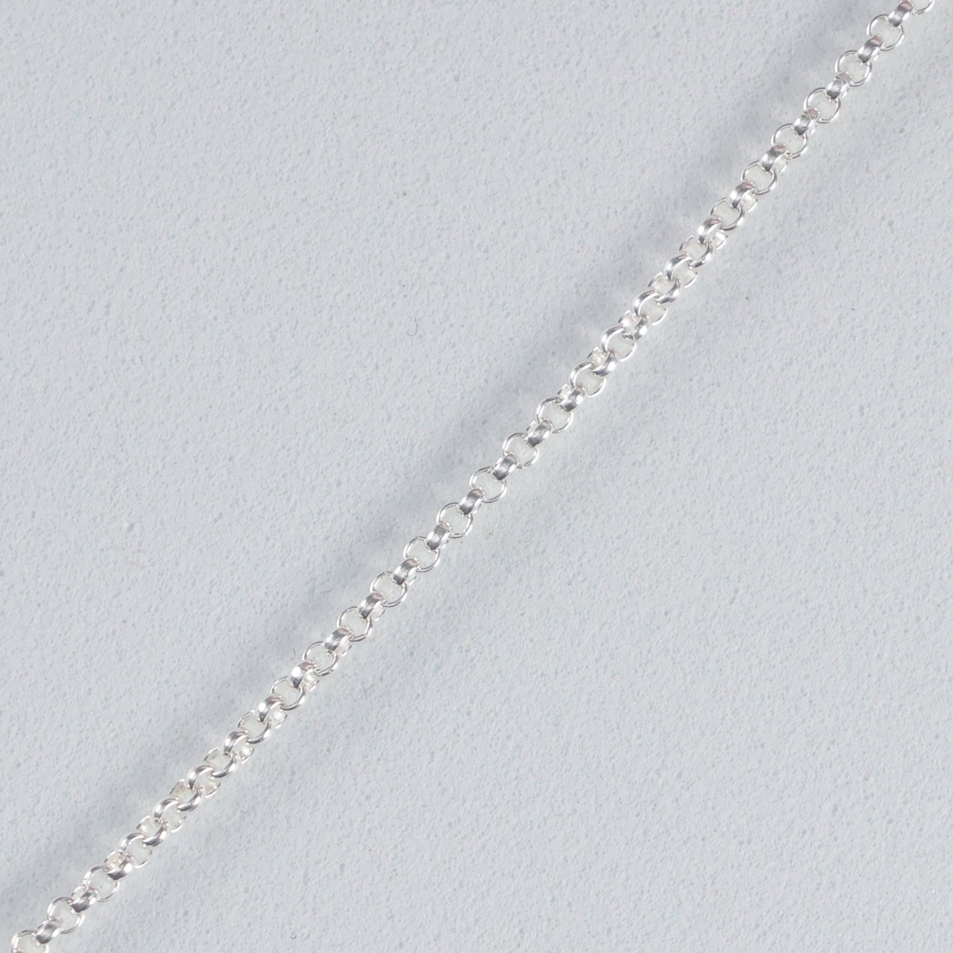Silver interlocking hoop necklace featuring a delicate chain and elegant design for stylish layering