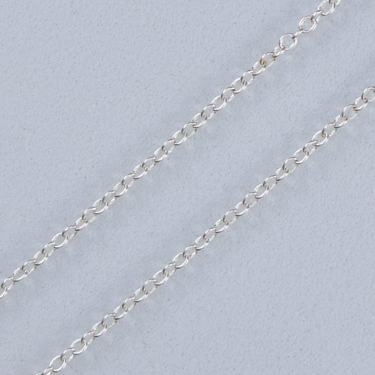 Delicate silver necklace with blue clover charm perfect for elegant outfits and everyday wear