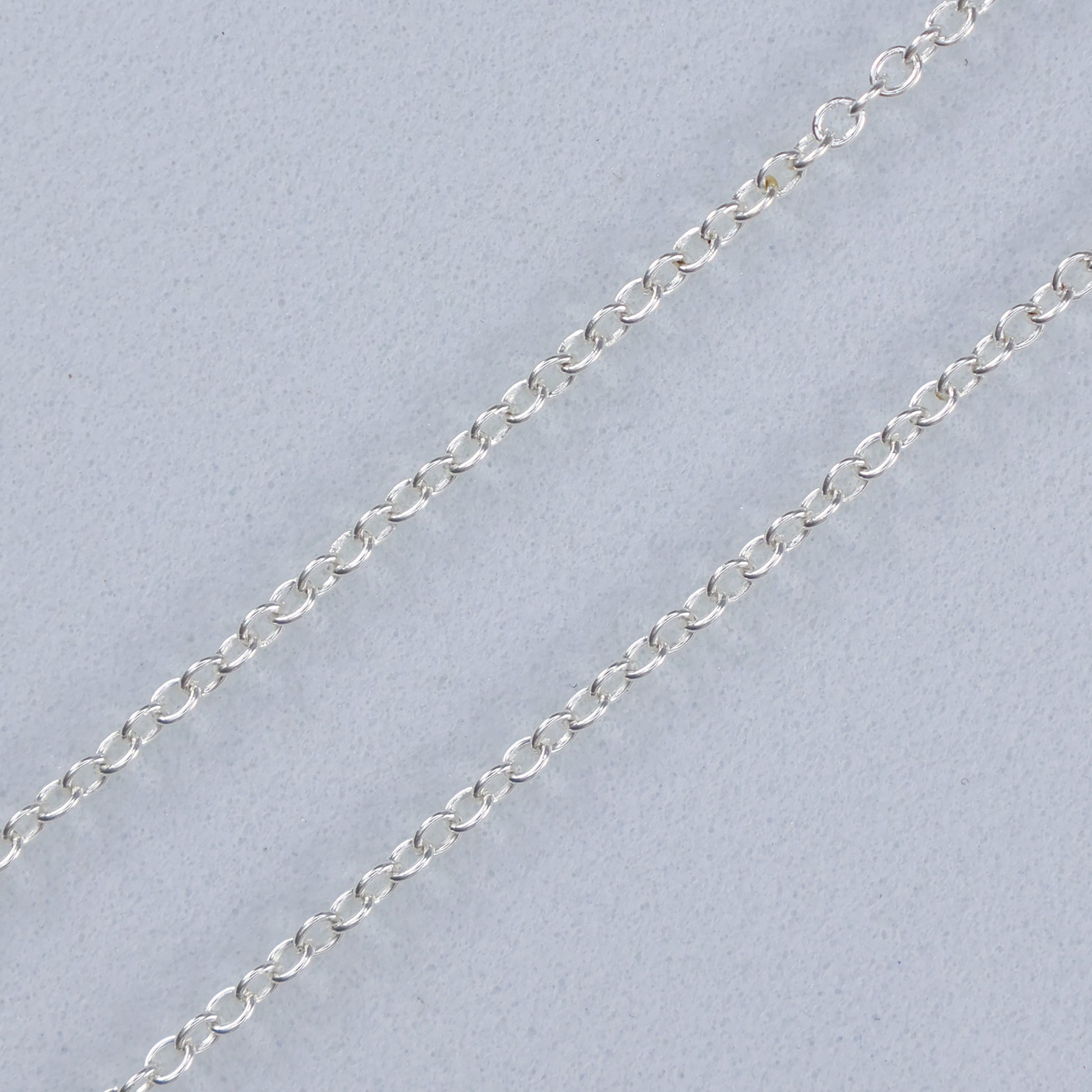 Delicate silver necklace with blue clover charm perfect for elegant outfits and everyday wear