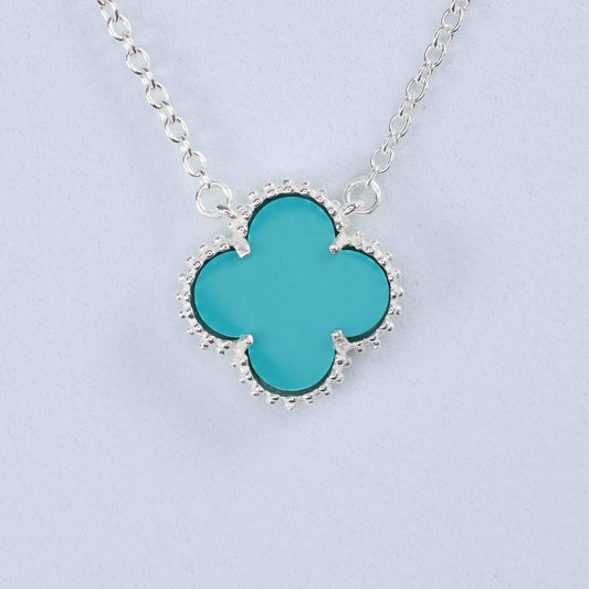 Silver necklace with blue clover pendant featuring a unique design for elegant style