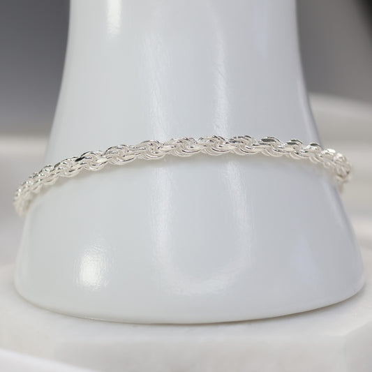 Elegant silver rope chain bracelet featuring a twisted design for a classic look