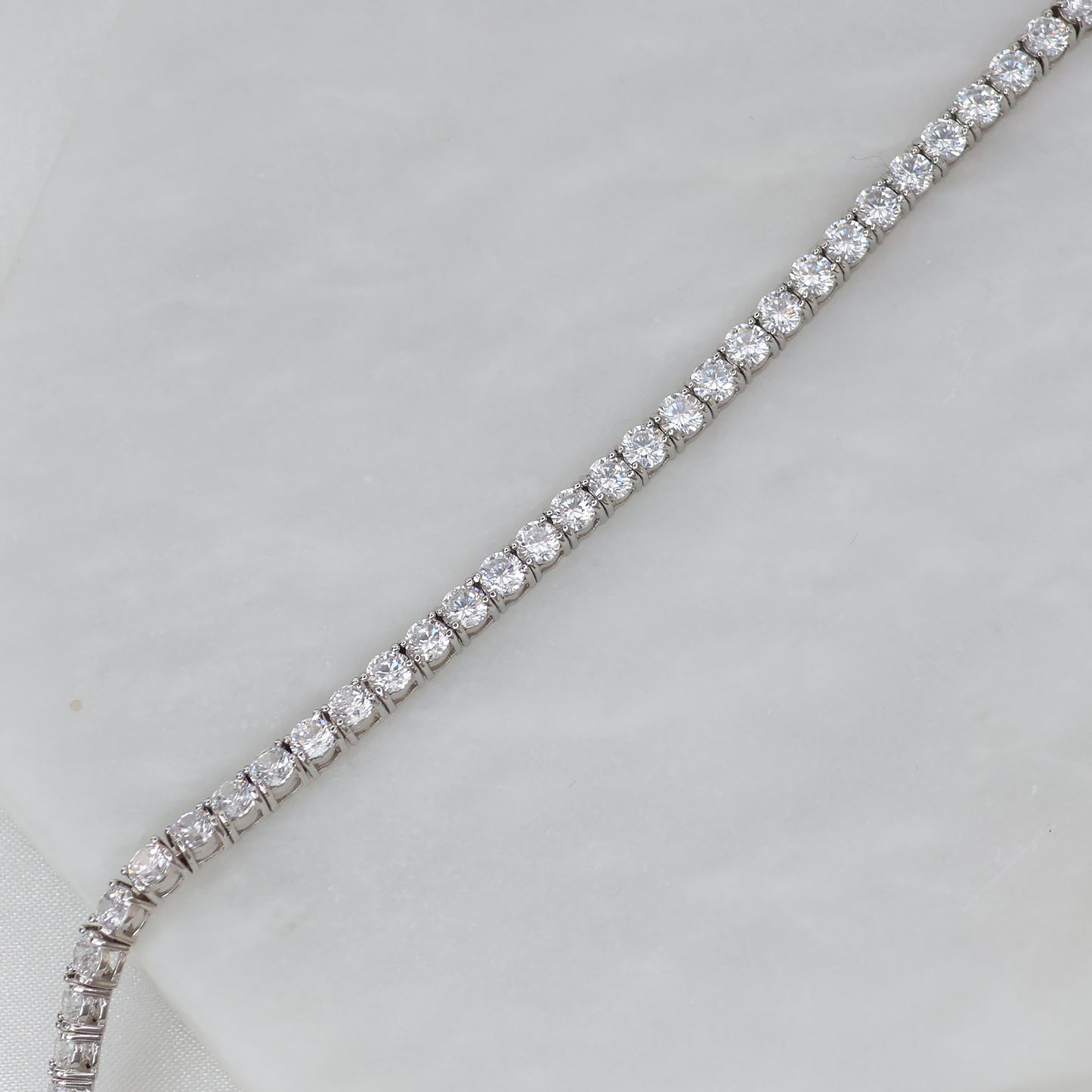 Elegant silver tennis bracelet featuring sparkling cubic zirconia stones for a timeless look