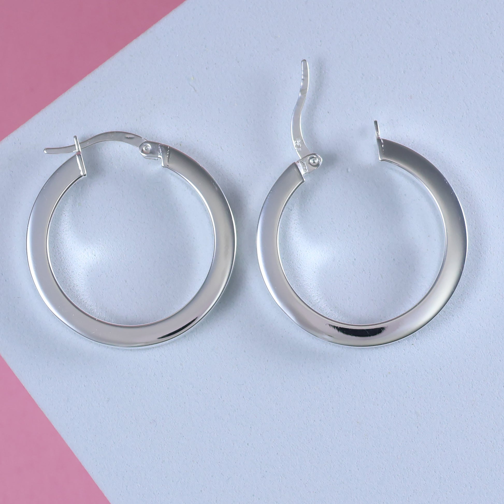 Elegant sterling silver hoop earrings with a polished finish for versatile everyday wear